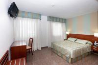 Postel nebo postele na pokoji v ubytování Hotel Marivella