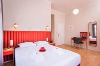 A bed or beds in a room at TheJoy City Suites