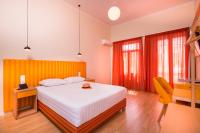 A bed or beds in a room at TheJoy City Suites