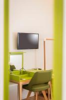 A television and/or entertainment centre at TheJoy City Suites