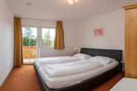 Łóżko lub łóżka w pokoju w obiekcie Haus Elisengrund am Geigenbuehel - chalet privé