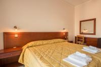 Postel nebo postele na pokoji v ubytování Blue Bay Hotel