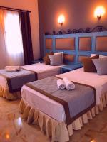 A bed or beds in a room at Hotel Atrium