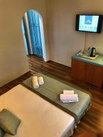 A bed or beds in a room at Hotel Atrium
