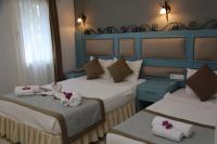 A bed or beds in a room at Hotel Atrium