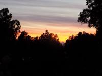 The sunrise or sunset as seen from a panziókat or nearby