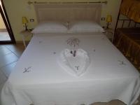 A bed or beds in a room at Al Ciclamino