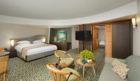 Ein Bett oder Betten in einem Zimmer der Unterkunft Dan Eilat Hotel