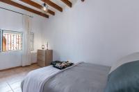 Postel nebo postele na pokoji v ubytování Town House Cas Decu