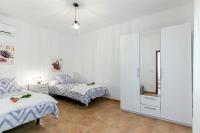 Postel nebo postele na pokoji v ubytování Town House Cas Decu