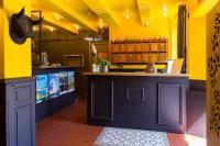a bar in a restaurant with yellow walls at Le Jardin d&#39;Emile in Cassis