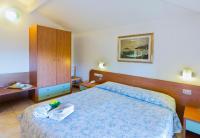 Postel nebo postele na pokoji v ubytování Hotel Darsena