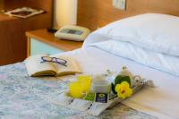 Postel nebo postele na pokoji v ubytování Hotel Darsena