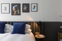 Postel nebo postele na pokoji v ubytování Kimpton De Witt Amsterdam by IHG
