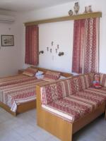 A bed or beds in a room at Vamos Palace Apartments