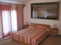 A bed or beds in a room at Vamos Palace Apartments