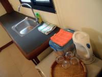 a small kitchen with a sink and a toilet at Moonstone Studio in Haad Rin