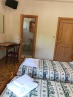 Posteľ alebo postele v izbe v ubytovaní Albergo Slalom