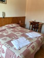 Posteľ alebo postele v izbe v ubytovaní Albergo Slalom
