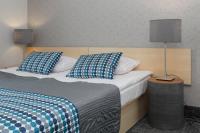 Posteľ alebo postele v izbe v ubytovaní Hotel Perła