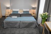 Posteľ alebo postele v izbe v ubytovaní Hotel Perła