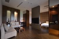 Una cama o camas en una habitaci&oacute;n de The Sun Hot Spring &amp; Resort