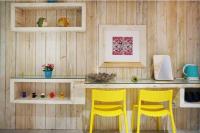 two yellow chairs sitting at a counter in a room at 湛藍海岸民宿 Azure--這個夏天有點藍--墾丁南灣沙灘-可包棟-國旅卡特約店 in Nanwan