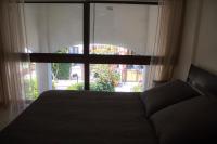 Postel nebo postele na pokoji v ubytování Galatex Beach Apartment