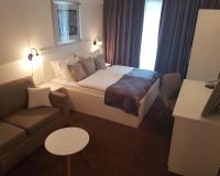 Łóżko lub łóżka w pokoju w obiekcie Hotel Argentum