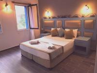 A bed or beds in a room at Hotel Atrium