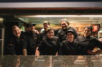 a group of people in a kitchen posing for a picture at Original Sokos Hotel Vaakuna Rovaniemi in Rovaniemi