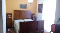 A bed or beds in a room at B&B Villa Carmen