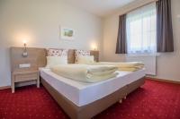 Posteľ alebo postele v izbe v ubytovaní Aparthotel Pichler