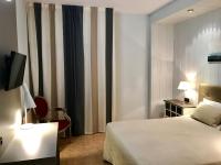 Posteľ alebo postele v izbe v ubytovaní Hotel Valjunco