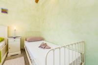 Łóżko lub łóżka w pokoju w obiekcie Holiday House Kate