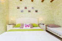 Łóżko lub łóżka w pokoju w obiekcie Holiday House Kate