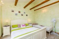 Łóżko lub łóżka w pokoju w obiekcie Holiday House Kate