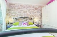 Łóżko lub łóżka w pokoju w obiekcie Holiday House Kate