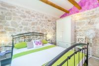 Łóżko lub łóżka w pokoju w obiekcie Holiday House Kate