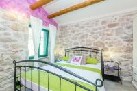 Łóżko lub łóżka w pokoju w obiekcie Holiday House Kate