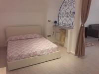A bed or beds in a room at Verdi's house