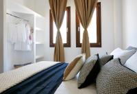 A bed or beds in a room at Le Blanc Suite
