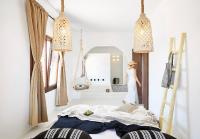 A bed or beds in a room at Le Blanc Suite