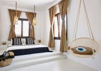 A bed or beds in a room at Le Blanc Suite