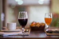 two glasses of wine sitting on a table at Spazio Marine Hotel - Guaratuba in Guaratuba