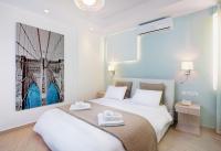 Łóżko lub łóżka w pokoju w obiekcie Christina Beach Hotel