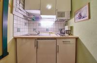 Kuchyň nebo kuchyňský kout v ubytování Appartements Alpin