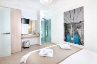 Łóżko lub łóżka w pokoju w obiekcie Christina Beach Hotel