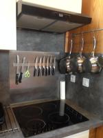 a kitchen with a stove with pots and pans at Gite du Cret in Hotonnes