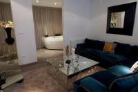 Posezení v ubytování madrid central gran via Suites